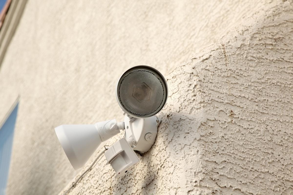 an outdoor motion sensor light on wall